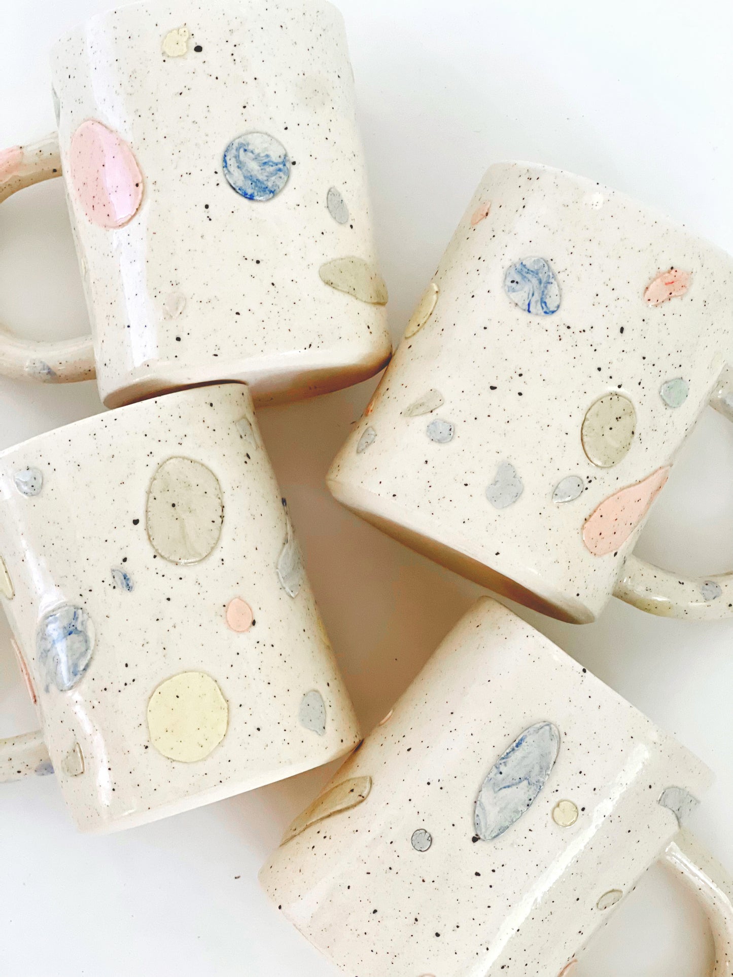 Designed for those who appreciate small details, the large Gemmy handmade ceramic mug is a stunning addition to any collection. Crafted with pastel color clay, this mug combines functionality with elegant design. Enjoy your favorite beverage while admiring the unique and beautiful details of this unique mug.