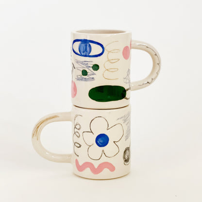 Experience endless fun and creativity with our Large Doodle Story Handmade ceramic Mug. This unique mug features a doodle drawing story design that will bring out your inner artist. Enjoy your favorite drink while unleashing your imagination. Elevate your drinking experience today.