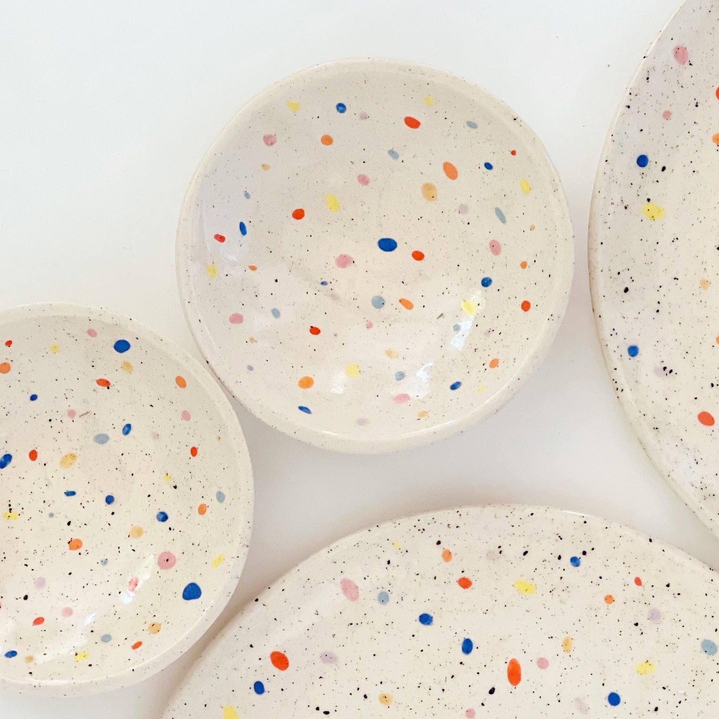 The Double Sprinkles Handmade Ceramic Snack Dish is perfect for any snack lover. With its double fun sprinkles design, it adds an extra touch of excitement to your snack time. Made with high-quality materials, it's durable and functional, making it a must-have for every kitchen. Get ready to enjoy your snacks in a whole new way!