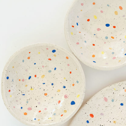 The Double Sprinkles Handmade Ceramic Snack Dish is perfect for any snack lover. With its double fun sprinkles design, it adds an extra touch of excitement to your snack time. Made with high-quality materials, it's durable and functional, making it a must-have for every kitchen. Get ready to enjoy your snacks in a whole new way!