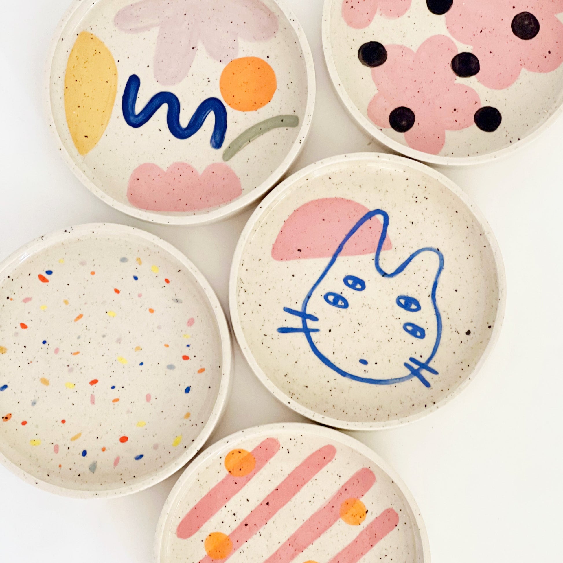 Elevate your dining experience with our 7" hand-painted and handmade ceramic dinner plates. With a mix and match of fun designs, each plate is a unique piece of art for your table. Add a touch of whimsy to your meals and impress your guests with these eye-catching plates.