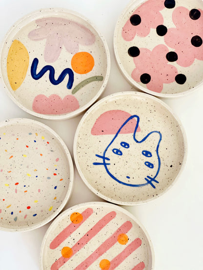 Elevate your dining experience with our 7" hand-painted and handmade ceramic dinner plates. With a mix and match of fun designs, each plate is a unique piece of art for your table. Add a touch of whimsy to your meals and impress your guests with these eye-catching plates.