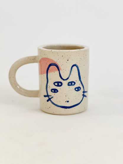 Introducing our Large Little Four Eyes Handmade Ceramic Mug, featuring our signature design inspired by our adorable and beloved pet, Bowl. This cute and unique mug is perfect for pet lovers. Handcrafted with care, it's the perfect addition to your morning routine. Brighten up your day with every sip!