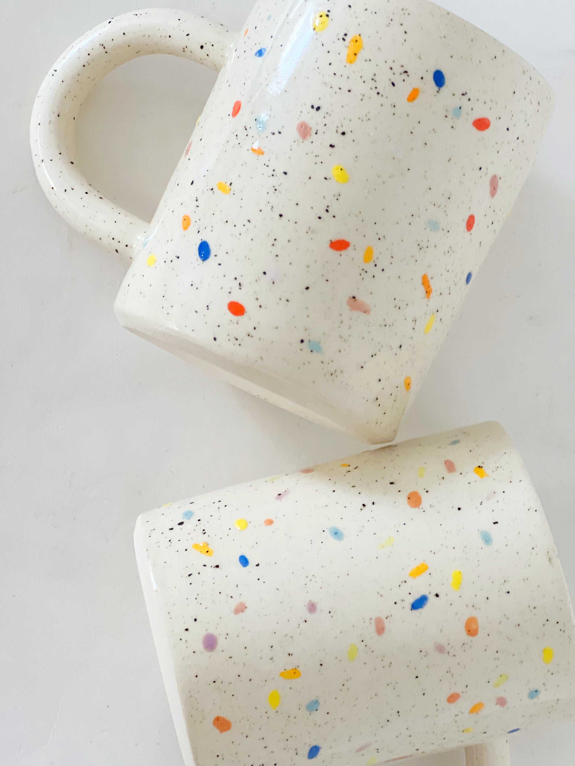 Add a pop of color to your morning routine with our Large Double Sprinkles Handmade Ceramic Mug! This bestselling design features double sprinkles, adding a touch of fun and happiness to your daily coffee or tea. Made with chic and vibrant colors, this mug is sure to keep your vibes high throughout the day.