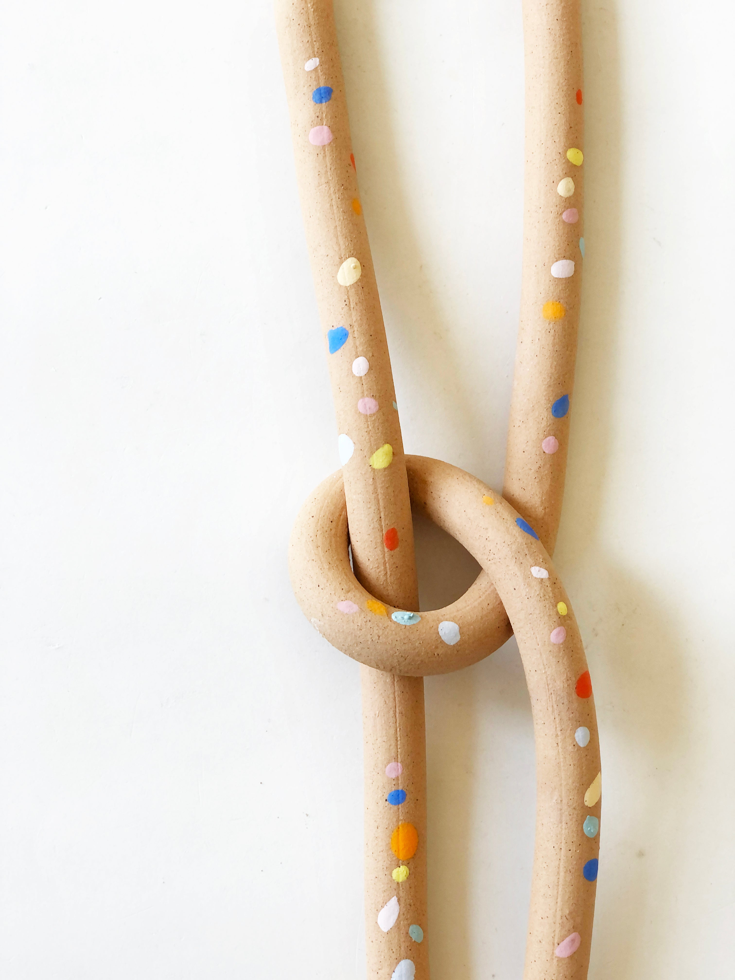 handmade, los angeles, ceramic, clay object, wall  hanging, art, pottery, clay object, rope, sprinkles, dots, bow
