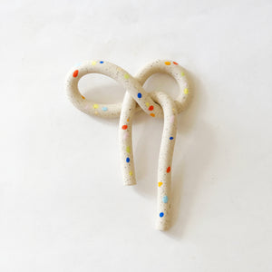 Clay Object 28 - Sprinkles Bow on White Speckles