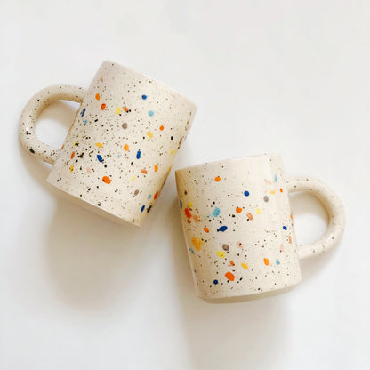 Add a pop of color to your morning routine with our Large Double Sprinkles Handmade Ceramic Mug! This bestselling design features double sprinkles, adding a touch of fun and happiness to your daily coffee or tea. Made with chic and vibrant colors, this mug is sure to keep your vibes high throughout the day.