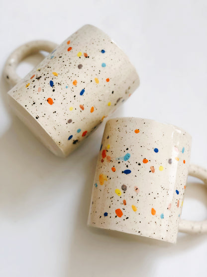 Add a pop of color to your morning routine with our Large Double Sprinkles Handmade Ceramic Mug! This bestselling design features double sprinkles, adding a touch of fun and happiness to your daily coffee or tea. Made with chic and vibrant colors, this mug is sure to keep your vibes high throughout the day.