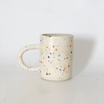 Add a pop of color to your morning routine with our Large Double Sprinkles Handmade Ceramic Mug! This bestselling design features double sprinkles, adding a touch of fun and happiness to your daily coffee or tea. Made with chic and vibrant colors, this mug is sure to keep your vibes high throughout the day.